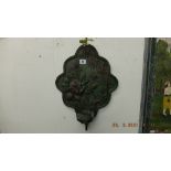 A decorative bronze wall sconce