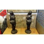 A pair of Bronze ladies with baskets