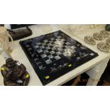 A mother of pearl inlaid, lacquered backgammon/ chess board,