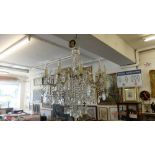 An antique ten branch crystal drop chandelier