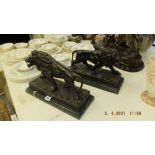 A pair of bronze lions on bases