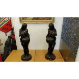 A pair of Bronze ladies with baskets