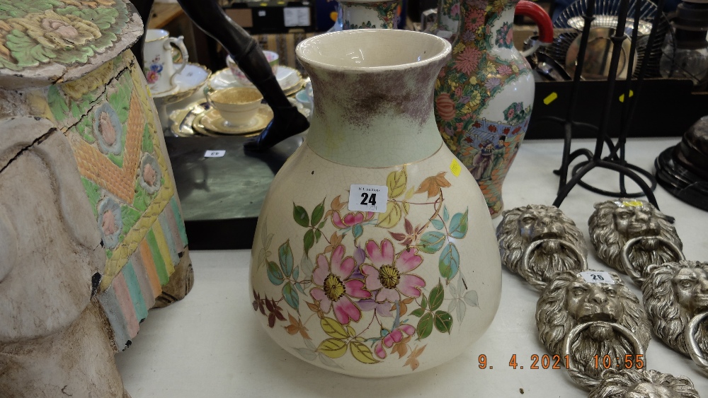A floral decorative vase marked T.E.M.
