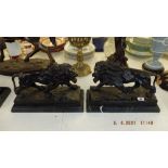 A pair of bronze lions on bases