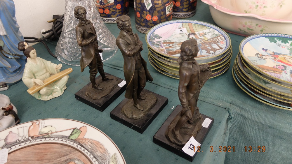 A bronze set of three Composers