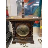 An Oak bracket clock and bracket