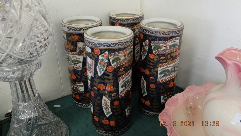 Four Imari style cylindrical vases