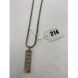 A hallmarked silver chain and a pendant,