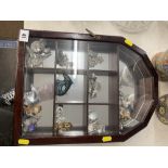 A small cabinet of crystal figures