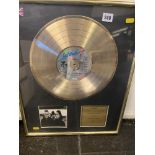 A framed and glazed Gold disc, U2,