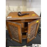 A carved smokers cabinet