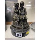 A bronze couple on base