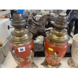 A pair of continental oil lamps