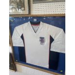 A framed England football shirt