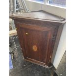 A 19th century inlaid Oak corner cupboard