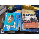 A collection of Andy Capp magazines/ books and a teapot