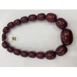 A Cherry coloured bead necklace