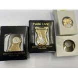 Four miniature brass clocks,