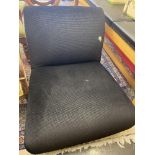 A small black upholstered chair