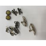 Five pairs of silver earrings