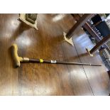 A gentleman's walking stick with 9ct gold strap/ bone handle