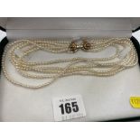 A five row cultured Pearl necklace on 18ct Diamond set clasp,