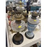 Five assorted oil lamps,