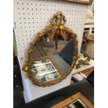 A small gilt mirror