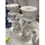 A pair of marble Cherub candlesticks