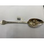 A hallmarked Silver berry spoon,