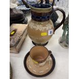 A Royal Doulton Harvest jug and a Royal Doulton cup and saucer