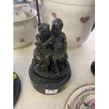 A bronze couple on base