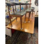 A Danish mid century extending table and six elbow chairs,