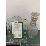 An antique Waterford decanter and a modern frame