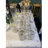 A decorative glass water jug, three commemorative large wine glass 'Diana,