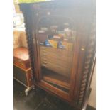 A 19th century barley twist display cabinet