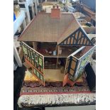 A vintage dolls house and fittings