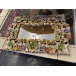 A gilt and jeweled mirror