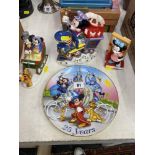 A Disney collectibles, three figures and a plate,