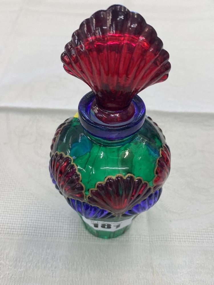 A glass coloured scent bottle lidded,