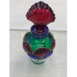 A glass coloured scent bottle lidded,