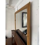 A large pine framed mirror