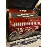 An Accordion in case,
