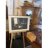 An artists easel and a sewing box