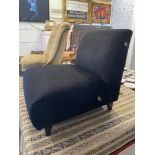 A small black upholstered chair