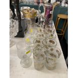 A decorative glass water jug, three commemorative large wine glass 'Diana,
