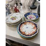 A large selection of assorted porcelain plates,