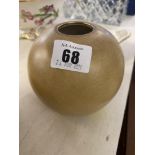 A cream coloured vase by Maryse,