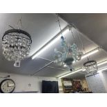 A pair of crystal chandeliers and two matching wall lights