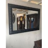 A black framed mirror